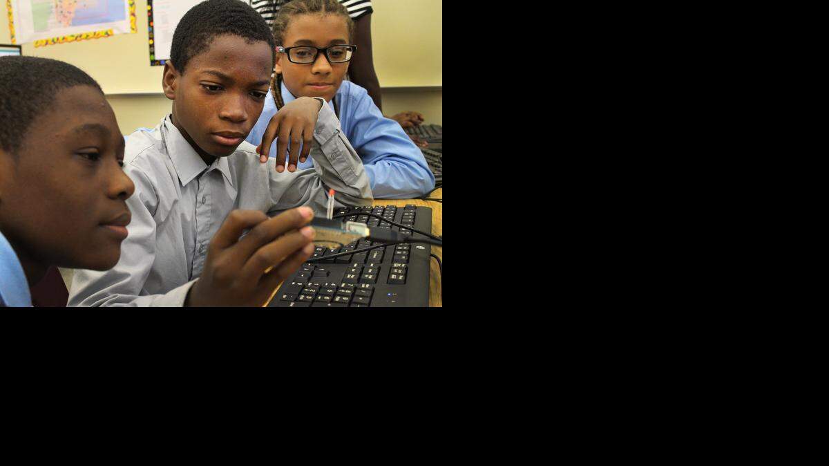 
Christopher Jules,  Steeve Jean-Louis and  Janiel Adames, all ninth graders at iTech @ Thomas A. Edison Educational Center in Miami.They are working on basic coding with the hope of being able to one day build their own small satellites that they can remotely control in space and conduct science experiments by studying the data collected by the satellites.
