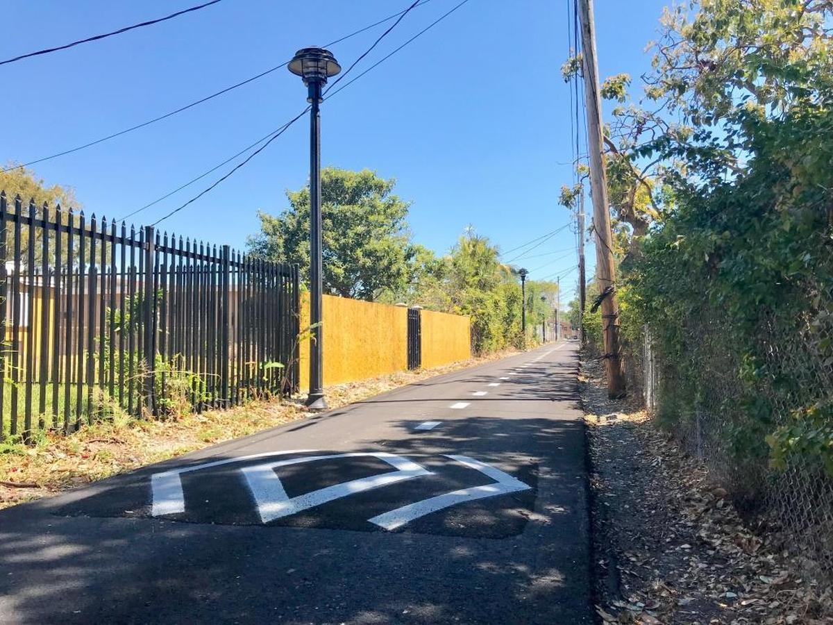 Alleys that were once poorly paved and dirty now have fresh pavement, speed bumps, striped bike lanes and improved lighting.