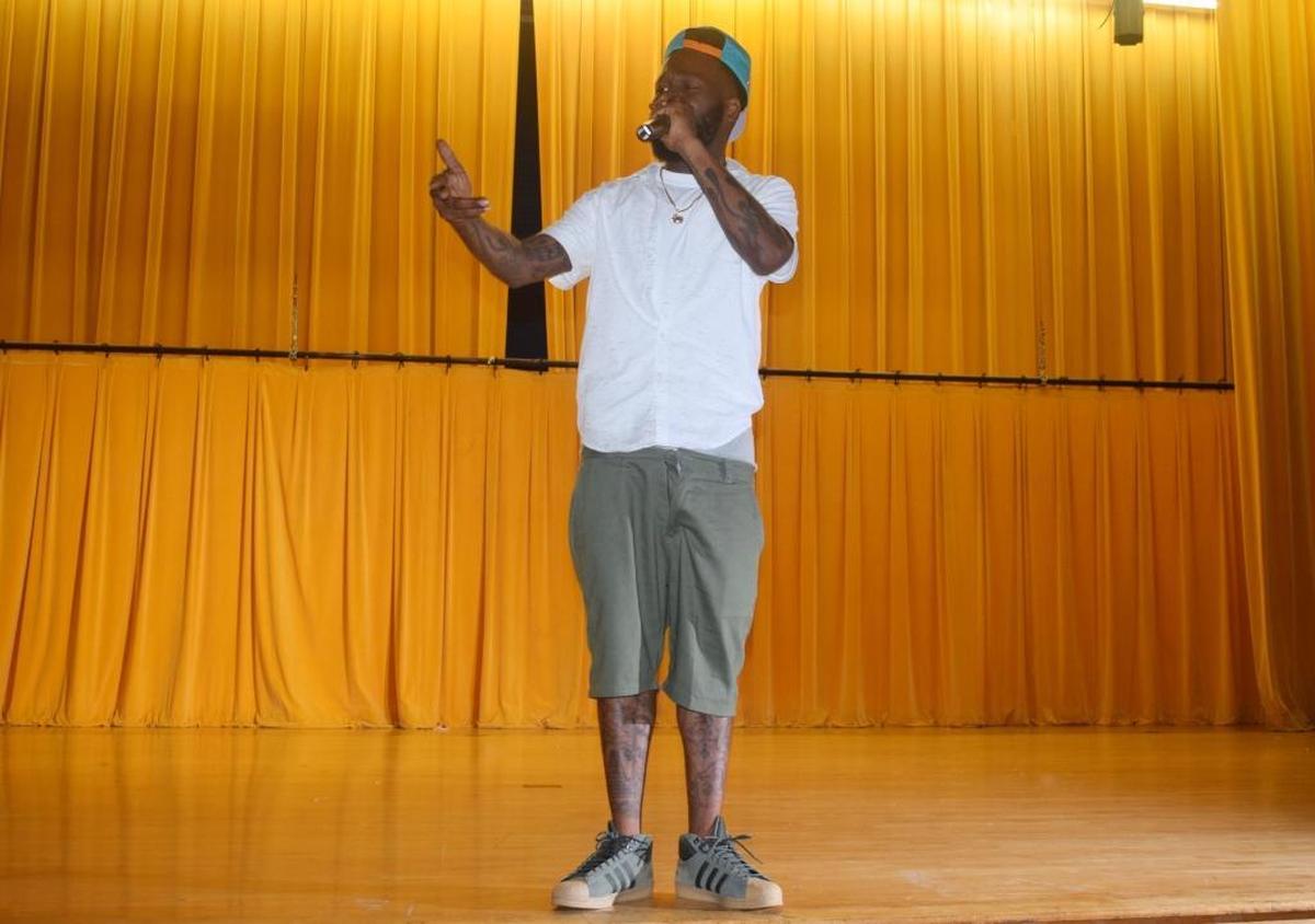 ‘Lost my only son to a gun, why Lord,’ says Santonio Carter as part of his song during his performance at the Save Our Youth dance recital.