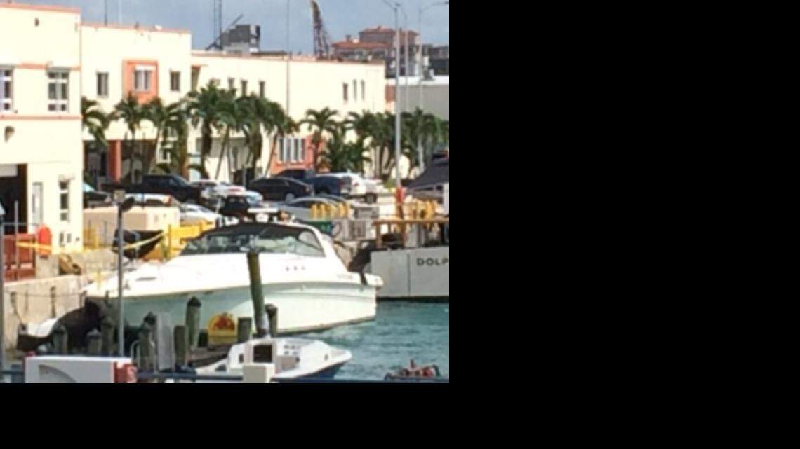 
A 63-foot Sea Ray is docked at the Miami Beach Coast Guard base Sunday after authorities say it collided with a 27-foot boat, killing a woman. 
