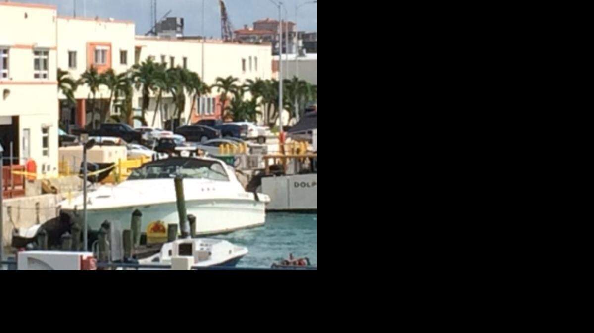 
A 63-foot Sea Ray is docked at the Miami Beach Coast Guard base Sunday after authorities say it collided with a 27-foot boat, killing a woman. 
