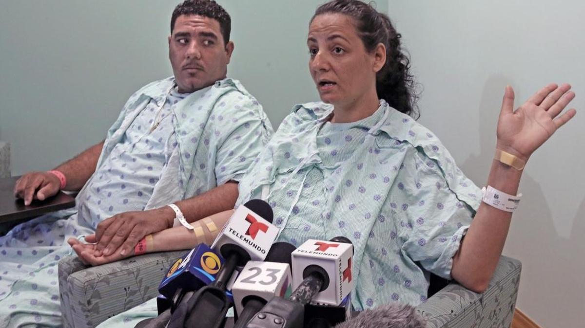 Cuban rafters Denny Rumbaut, left and Yarelys Rios, who's pregnant, explains the ordeal of getting shot while leaving the island of Cuba in a small boat along with 24 others. A total of seven of them were shot by a gang of delinquents attempting to steal their boat, they claim on Monday March 28, 2016
