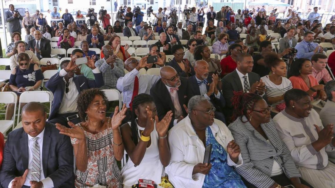 Attendees cheer during a groundbreaking ceremony for the Liberty Square Rising project.