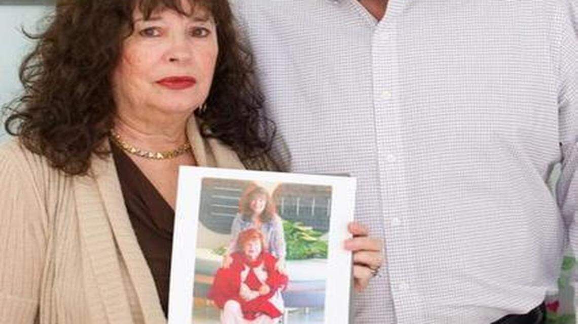 
Dr. Sam Sugar and his wife, Judy, who is holding a photo of her late mother. 
