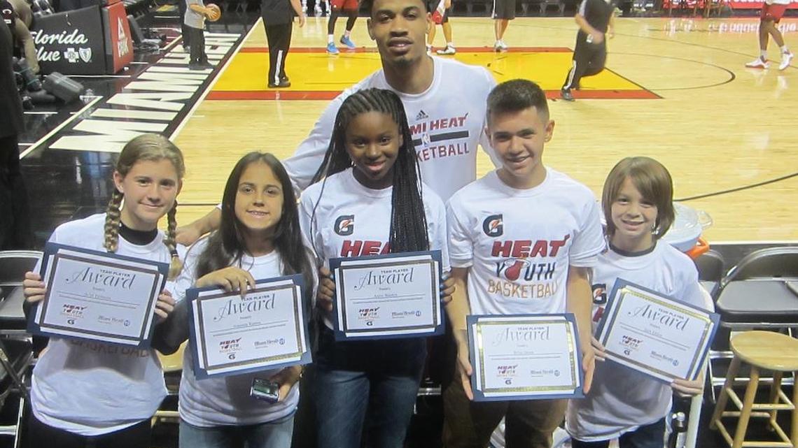 Miami Heat forward Gerald Green congratulates Ariel Fishman (Hochberg Prep), Amanda Ramos (Pinecrest Preparatory), Anise Wooten (Cushman School), Brian Orosa (Devon Aire K-8 Center), and Jack Dillon (Aventura Charter School) for being the Miami Heat/Miami Herald January Academic/Sportsmanship Team Players in conjunction with Gatorade. They were later honored on the court before the Heat/Milwaukee Bucks game at the AmericanAirlines Arena.