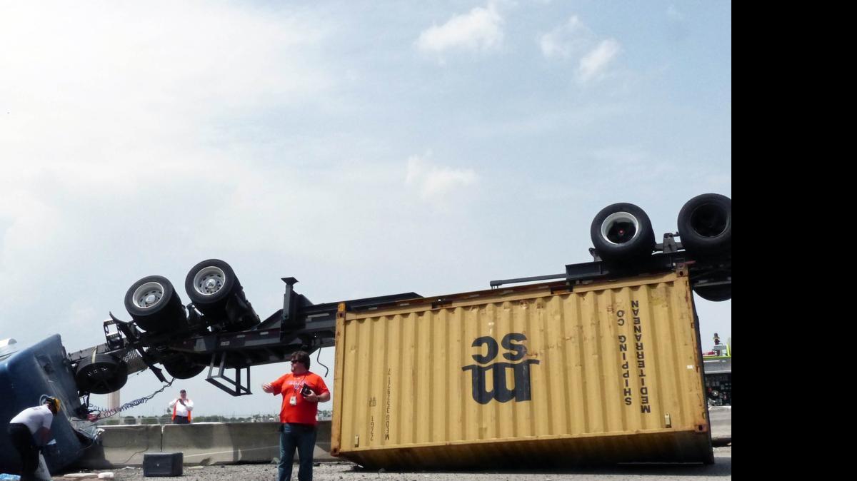
A flipped truck blocks traffic during afternoon rush hour on State Road 836 near Northwest 72nd Avenue on Tuesday, June 30, 2015.

