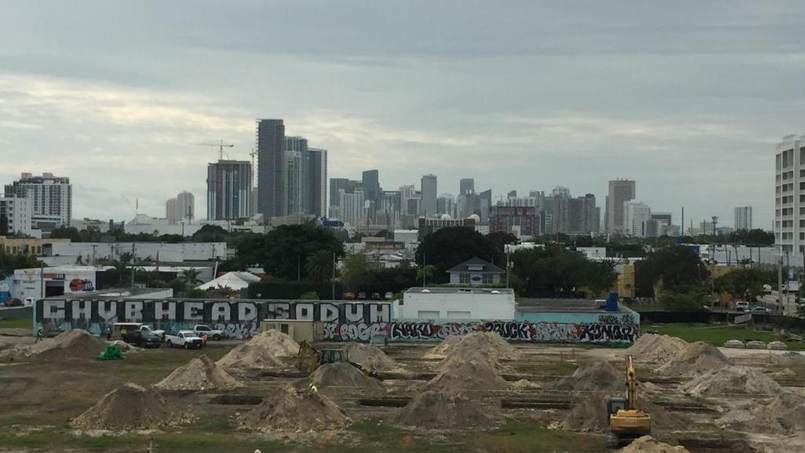 Crews dig trenches at Walmart’s Midtown site on Jan. 8, 2015.