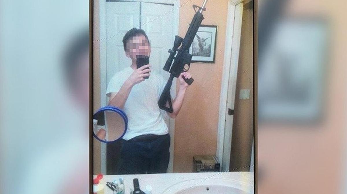 A Miami-Dade Public Schools student was questioned by police after posting a photo on Snapchat of himself holding an assault-style rifle and a menacing message.