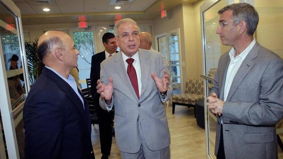 Miami Mayor Tomas Regalado, center, chatted with Mitchell Friedman, left, and David Deutch, right, both partners from the Pinnacle Group, which built Vista Mar, an affordable housing rental complex in Miami. The project is one of four Pinnacle projects that the federal government said was involved in stealing federal money by inflating the costs of the tax-subsidized apartment project. A now-defunct construction company affiliated with Pinnacle was charged. Pinnacle’s four partners and a fifth principal were not charged.
