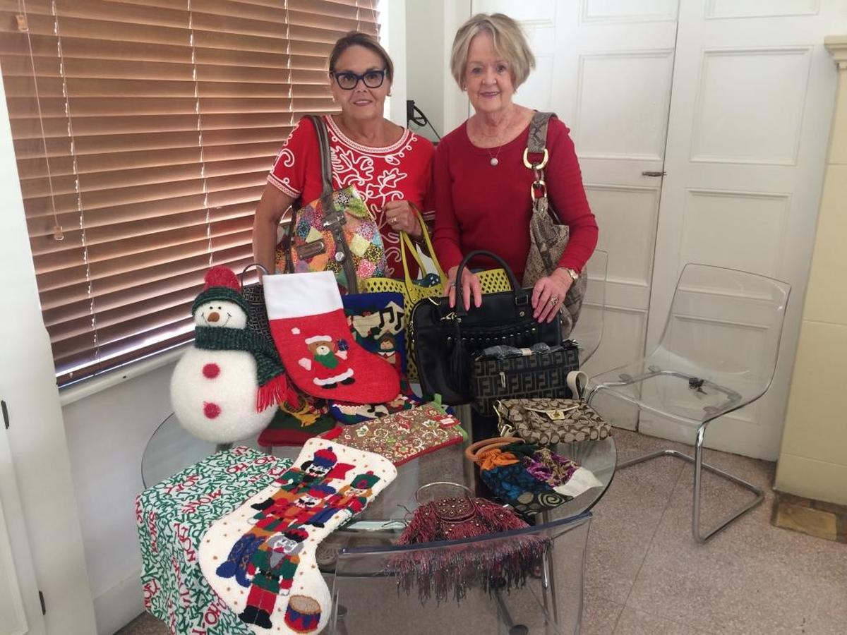 Organizing gifts for sale are Michele Locicero and Sara Lee Sanderson, co-chairs for the Ultimate Bazaar to be held at the Coco Plum Woman’s Club Oct. 28. All proceeds from the handmade holiday items, clothing and much more are donated to the University of Miami Miller School of Medicine, Sylvester Comprehensive Cancer Center for cancer research.