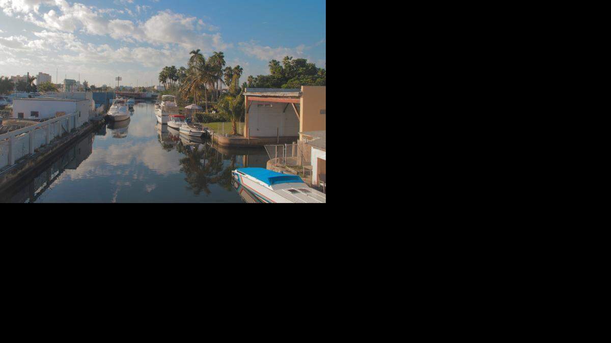 
The Seybold Canal, part of Wagner Creek, merges with the Miami River near Northwest Seventh Avenue. Long considered one of the Miami’s most polluted waterways, the creek may finally be getting cleaned up. River advocates and Miami officials say they've lined up enough money to dredge and clean the creek.
