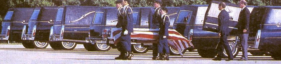 An honor guard escorts the caskets of the seven astronauts killed in the space shuttle Challenger disaster as they leave Kennedy Space Center.