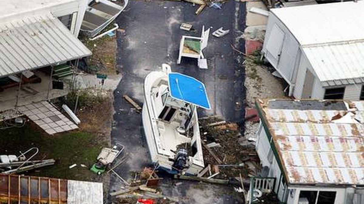 
An aerial shot after Hurricane Frances in 2004 shows a boat and debris in a street east of Fort Pierce.
