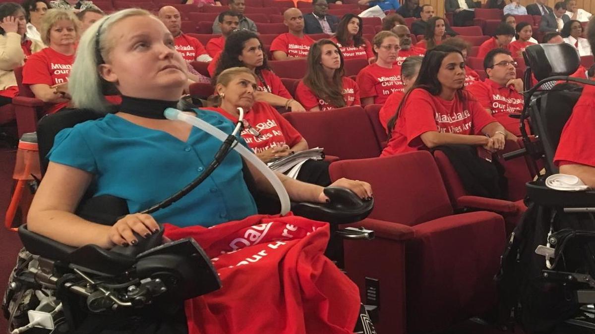 Ashley Moore, an advocate for red-light cameras who was paralyzed in an auto accident 18 years ago, watched from the front row Wednesday as Miami-Dade commissioners advanced legislation that would prevent the county from installing the devices at intersections outside of city limits. Part of the fines tied to red-light violations supports research into paralysis treatment.