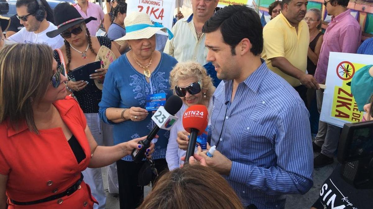 Alfred Santamaria, a candidate for Miami-Dade mayor, addresses reporters in Wynwood on Tuesday, Aug. 23, while handing out Zycazin, a product made by a donor that he said can “neutralize” Zika. Health officials say there is no treatment for Zika.