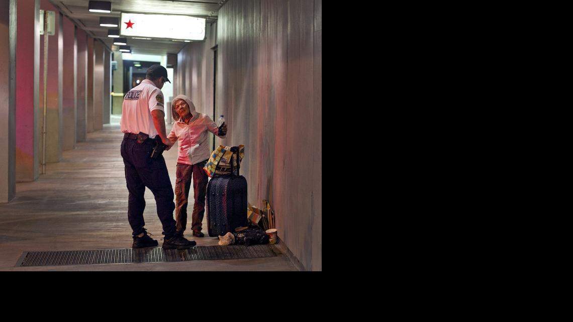 
Miami Police officer Gregg Vassari asks a homeless woman in downtown Miami on Tuesday, February 17, 2015, if she would like to move to a shelter as Miami’s police outreach team works with the homeless by offering shelter in the Mat Program. If a proposed new law is approved next month it would essentially outlaw homelessness by banning people from sleeping on public property with pillows, blankets and other everyday items.
