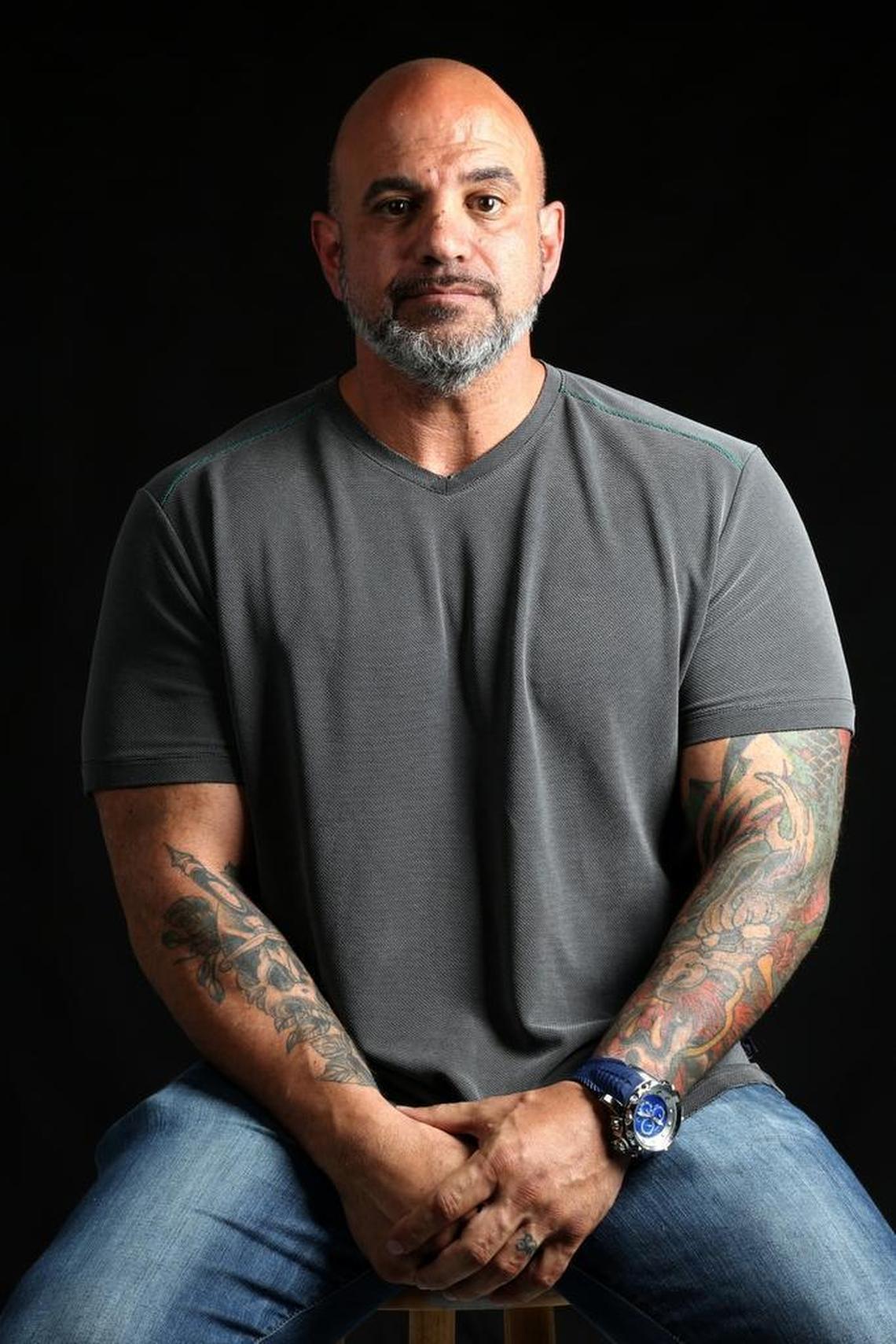 David Coriaty is accused in a lawsuit of running a Ponzi scheme while pretending to be a former member of the Miami Dolphins. He says he did nothing wrong and says a onetime board member tanked the company.