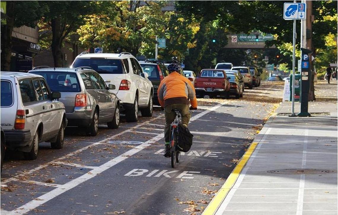 A bike lane in Portland, Ore., is protected by parked cars from moving traffic. Miami Beach will install parking-protected lanes on West Avenue and Euclid Avenue on South Beach.