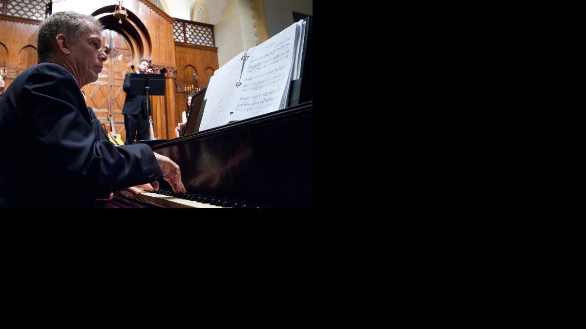 
Alan Mason, music director at Temple Israel of Greater Miami, left, accompanies Steven Hevenstone, from B'nai Torah Congregation in Boca Raton, in a rendition of ‘Tikanta Shabbat’ during the 2012 Winter Jewish Music Concert at Temple Israel of Greater Miami near downtown Miami. Several hundred people attended the event, which featured music from Jewish, Israeli, folk, Yiddish, pop, classical, and other genres.
