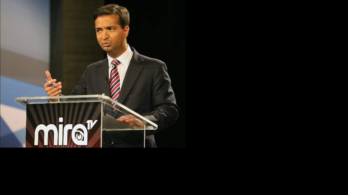 
Carlos Curbelo, pictured here at a televised debate, has refused to disclose his firm’s clients.
