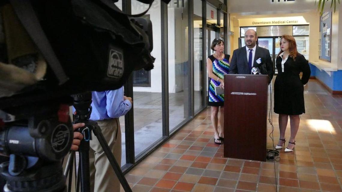Members of An Accountable Miami-Dade held a press conference at the Stephen P. Clark Government Center Tuesday morning to announce a lawsuit against Miami-Dade to force a quick count of the signatures on the petitions gathered to put new restrictions on campaign cash on the November ballot. From L-R are Monica Russo, co-chair of An Accountable Miami-Dade; spokesman Christian Ulvert; and Bettina Rodriguez Aguilera, former vice-mayor of Doral and co-chair of the group.