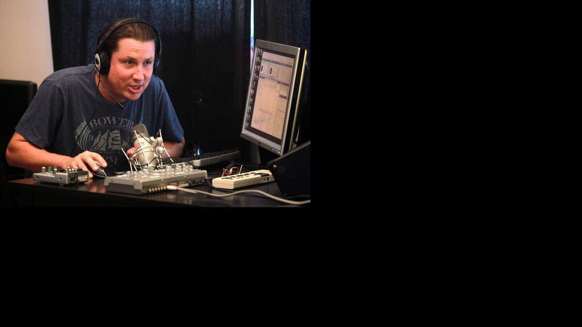 
Peter Stebbins, is the CEO of Shake 108, Miami's new FM radio station. Stebbins runs the station off a Dell work station at his Morningside home, Wednesday, Sept. 17, 2014.
