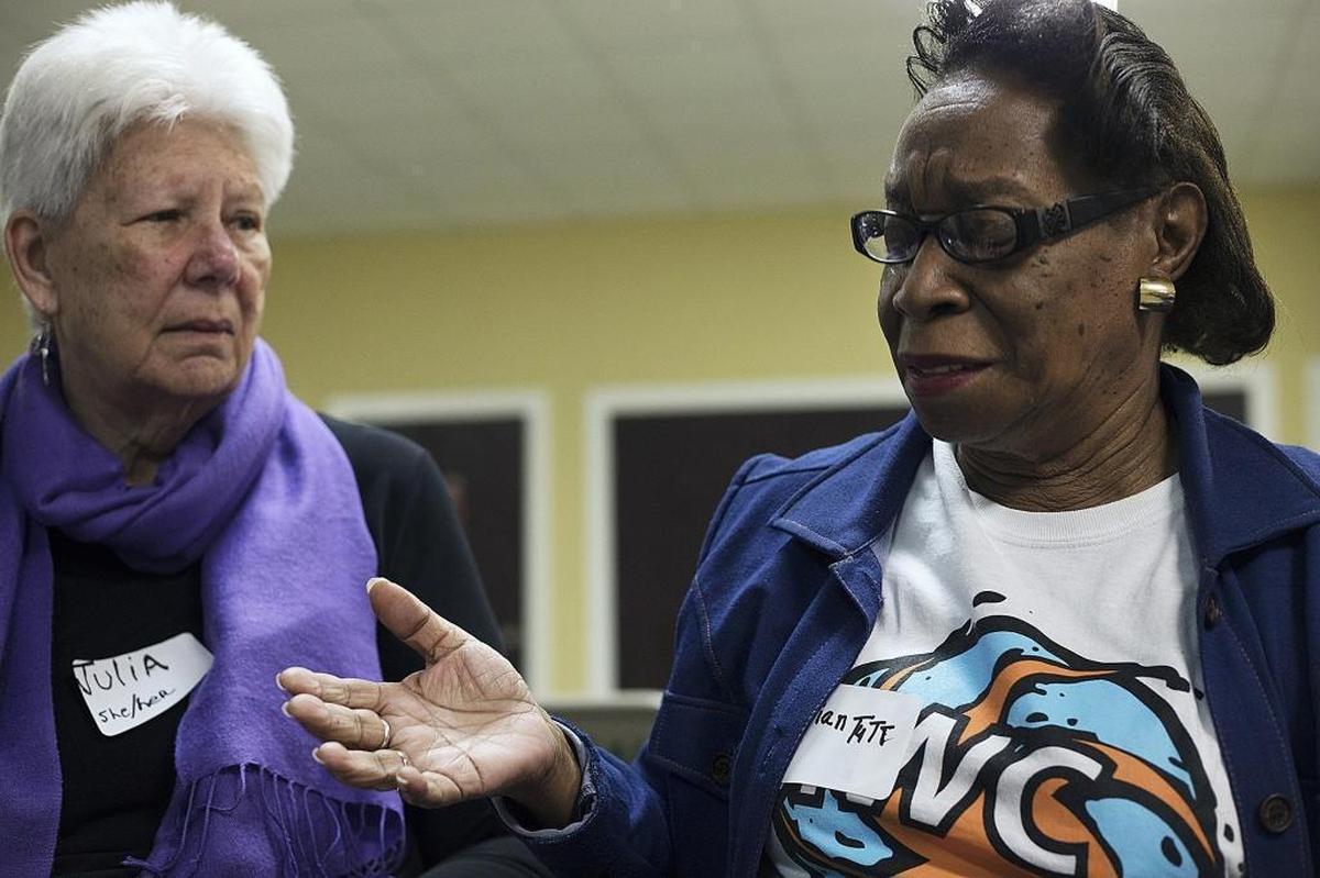 (L-R) Júlia Dawson, 76, and Vivian Tutt, 79, take part in the Women’s Circle gathering at the Miami Workers Center.