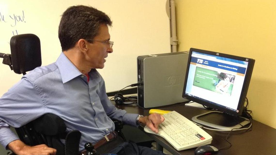 
Carlos Borges, 53, works at his desk after a recent tutoring session at the Florida International University's Center for Excellence in Writing. Borges says he writes notes about the tutoring session to use it for future reference. 
