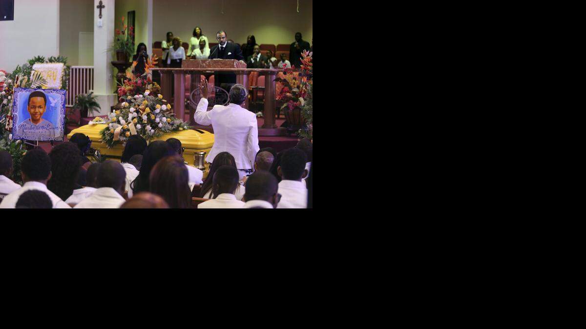 
MOURNING MARLON: 93rd Street Community Baptist Church Pastor Carl Johnson, top right, leads the funeral service for Marlon Eason, a 10-year-old boy killed by gunfire outside his Overtown home in March, on Saturday, April 4, 2015. The Miami church held back-to-back funerals for two young victims of gunfire, killed within hours of each other on March 24, 2015. The first funeral was for Richard Hallman, 16, a student at Booker T. Washington Senior High. The second was for Marlon, who attended Life Academy Charter School. Marlon's casket is yellow, his favorite color. The church is at 2330 NW 93rd St., Miami.
