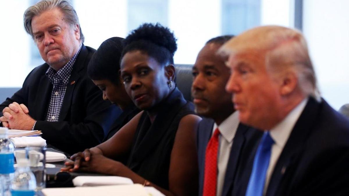 Stephen Bannon, left, chief executive of Republican Donald Trump's campaign, is pictured during a roundtable with Trump, right, and the members of the Republican Leadership Initiative in New York on Aug. 25.