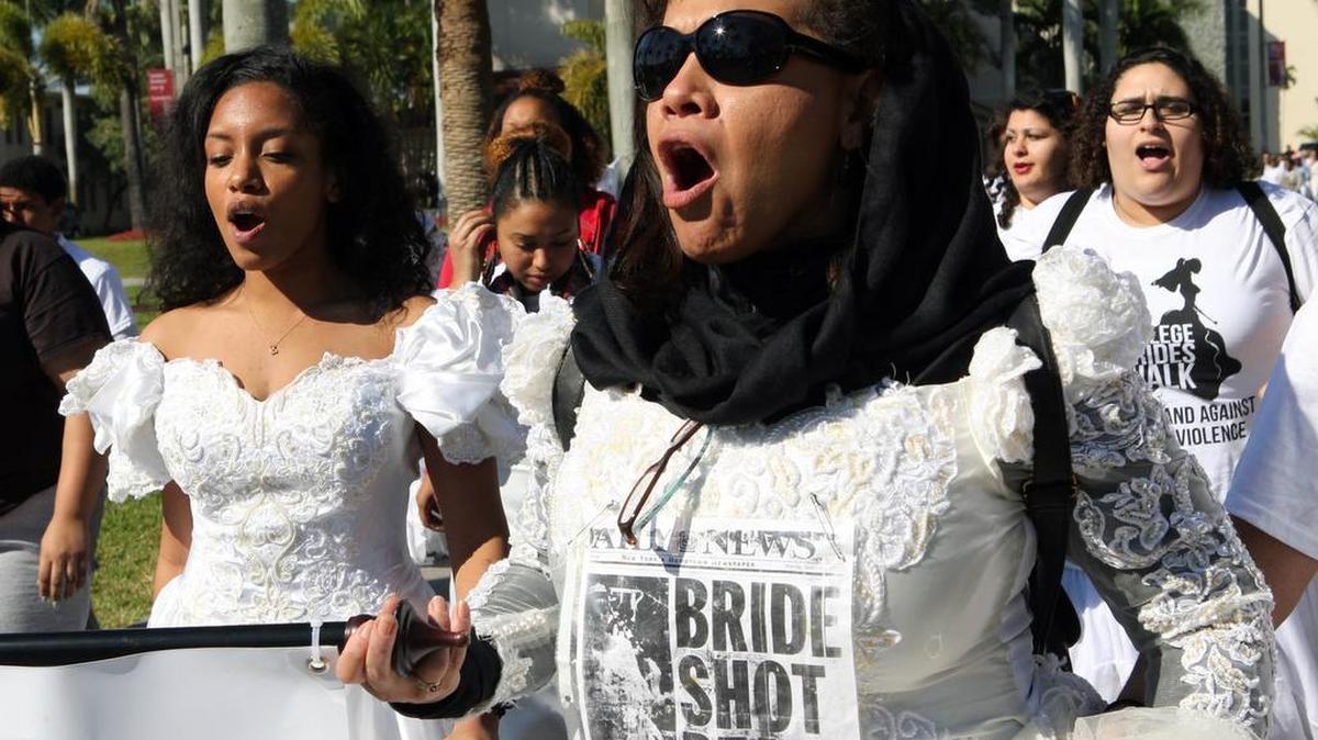 
Protesters speak out against domestic violence in Miami in February
