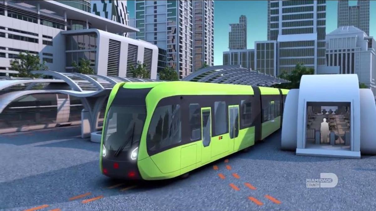 A rendering of a ‘trackless train’ being tested by a Chinese company. The rubber-wheeled vehicle is billed as having the ability to manually follow ‘virtual tracks’ on highways — painted lines on the roadway that would guide the autonomous vehicle to its destination A delegation from Miami-Dade County is set to visit the company, CRRC, during a trip to China in March 2018.
