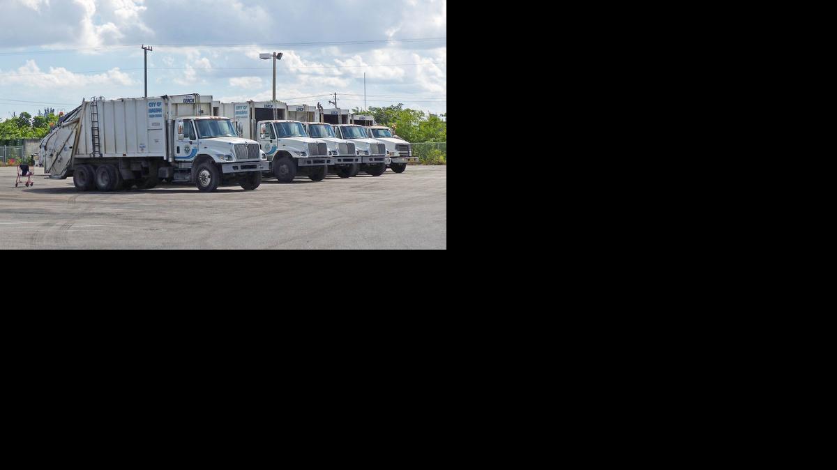 
Hialeah garbage trucks are parked on city property. The city plans to privatize the sanitation department.

