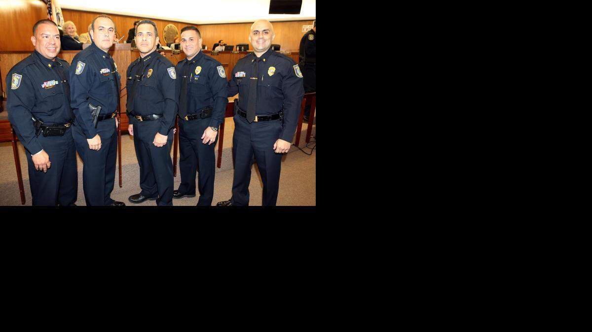 
Left to right are: Fernando Villa, Manuel Rodriguez, Hialeah Chief of Police Sergio Velazquez, Ernesto Gutierrez and Orlando Salvat. Rodriguez was promoted to the rank of major; the other three were promoted to commander ranks.
