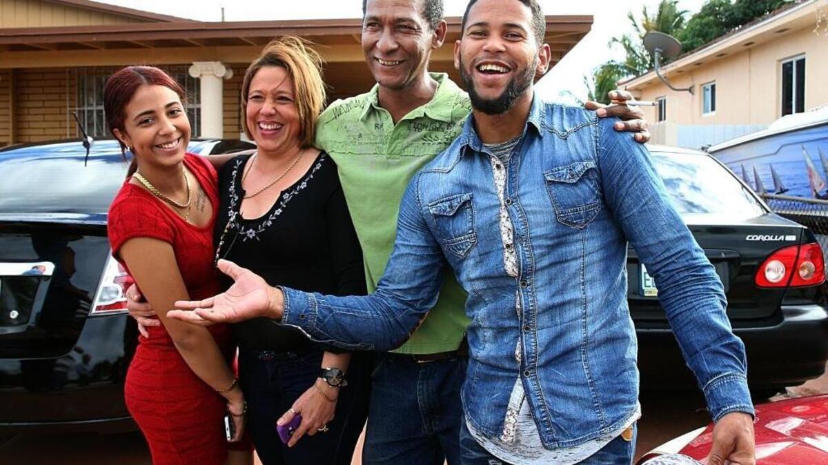 Cuban Alvaro Moreno, far rightm reunited with his cousins, from left, Merisi Roman, Maria Eugenia Fernandez and Horacio Wilson, in Hialeah. Moreno arriving in a van from Texas after crossing into the United States from Mexico on Jan. 12. He was one of the last Cubans allowed into the U.S. under the wet foot, dry foot policy.