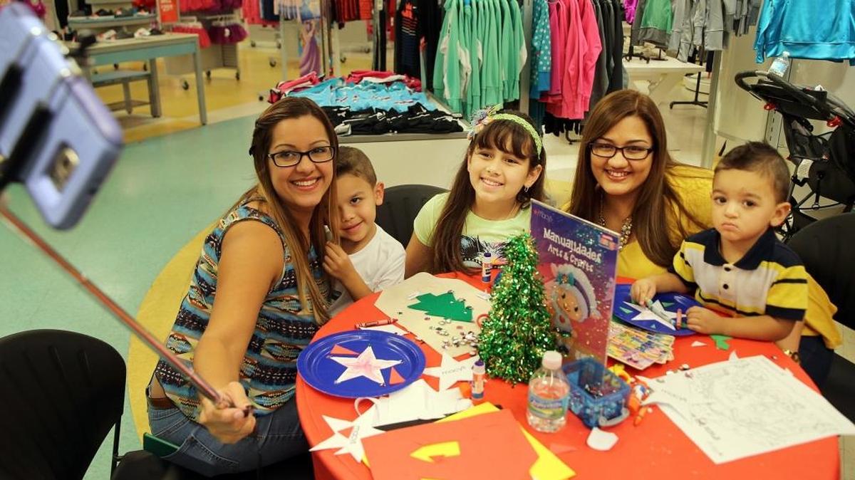 From left, Karla, Joel, Arlanni Velez, Alejandra Ramos and Christian Yroa pose for a selfie as they wait for the Three Kings to arrive during an event Saturday, Jan. 2, at Macy’s in Westland Mall in Hialeah.