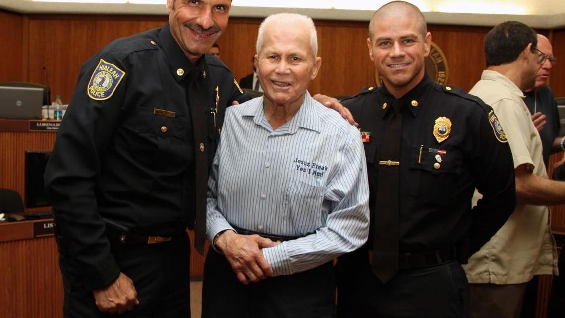 Hialeah Police Lt. Leo Thalassites, 90, poses for a photo at Hialeah City Hall with Lt. Carl Zogby and Lt. Eddie Rodriguez.