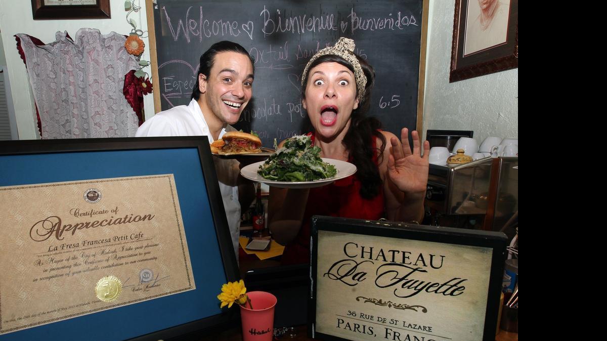 
Benoit Rablat and Sandy Sanchez, owners of the La Fresa Francesa Petit Café, celebrate on opening day. 
