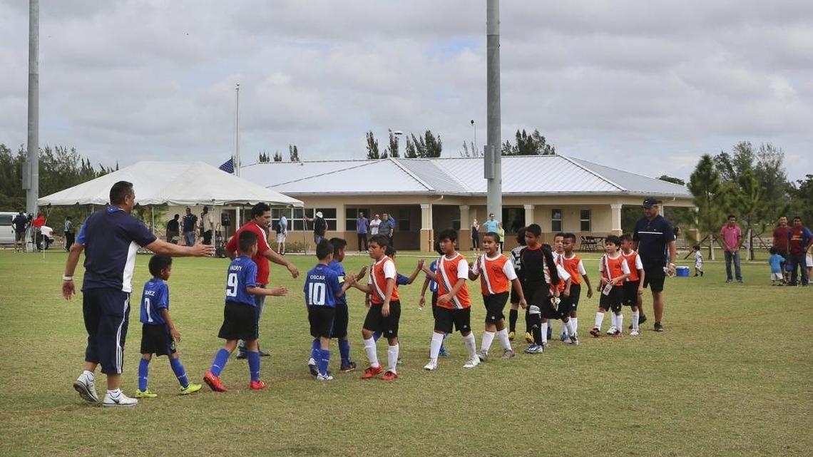 Players and coaches from International Soccer Academy U8 and Miami Shenandoah U8 extend congratulations after a match on a new soccer field at Amelia Earhart Park on Saturday, Nov. 21, 2015. The Miami-Dade County Parks, Recreation and Open Spaces Department unveiled the newly-completed soccer complex Saturday. The “Building Better Communities” General Obligation Bond and Quality Neighborhood Improvement Program funded the state-of-the-art public soccer facility. It created a venue for youth and adult soccer tournaments. Amelia Earhart Park is at 401 E. 65th St. in Hialeah.