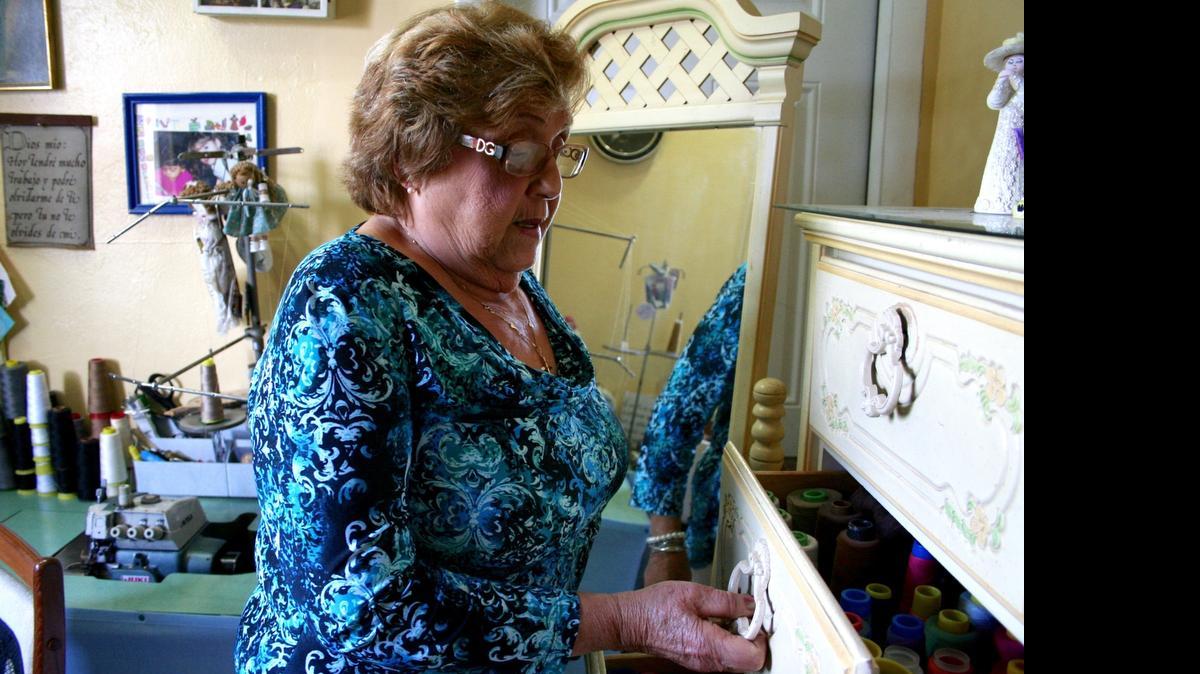 
Yolanda Martinez Fuentes,77, has a sewing room in her home, where she keeps drawers full of multicolored threads. As a retiree, Martinez Fuentes has been sewing and mending clothes for friends, family and other members in her Hialeah community.
