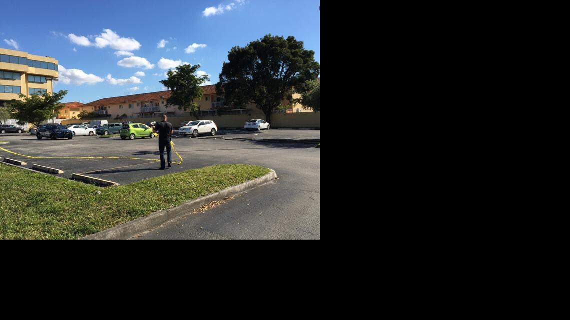 
A Hialeah police staffer removes crime-scene tape from Las Tabernas de Wancho at 2100 W. 76th St. on Sunday,
