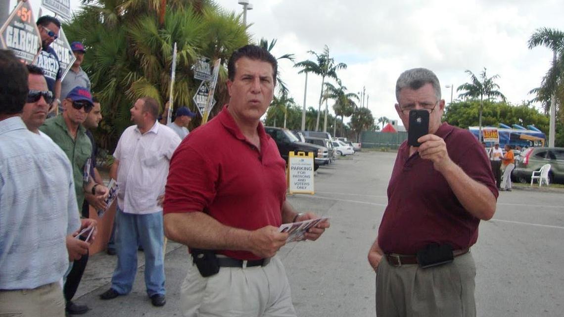Former Hialeah police officer, Glenn Rice, right, with Mayor Carlos Hernández during 2011 campaign.