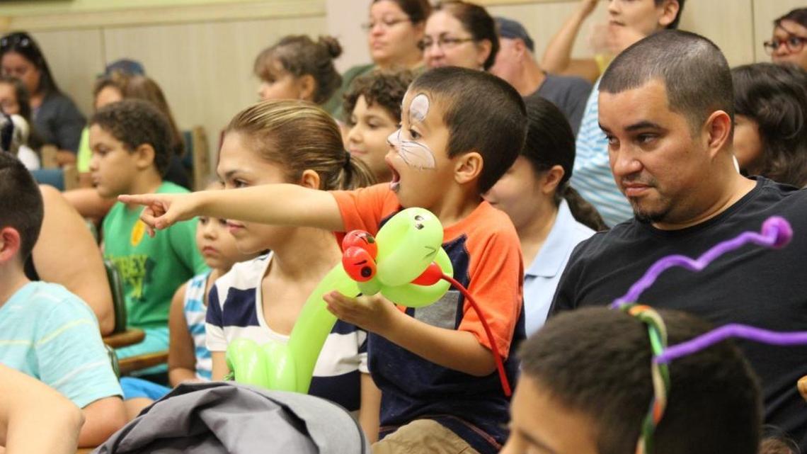 
Jeremiah Sanchez, 5, of Hialeah, points with excitement as a magician does a trick during the annual Literacy Fair at JFK Library in Hialeah.
