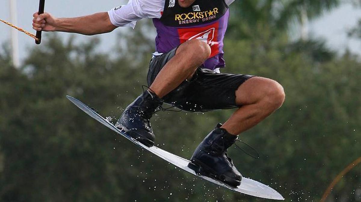 
A wakeboader takes part in the "2015 Nautique WWA Wakeboard National Championships" at the Miami Watersports Complex at Amelia Earhart Park in Hialeah, Saturday, August 15, 2015. The event was hosted by Miami-Dade County Parks, Recreation and Open Spaces Department in partnership with the World Wakeboard Association (WWA) and Rockstar Energy.
