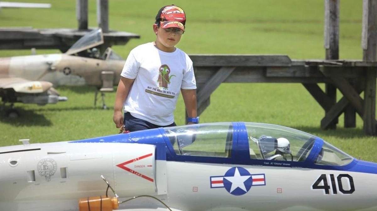 Javier Vallejo, 7 of Cutler Bay, admires a quarter-scale L-39 Albatros turbine jet owned by J.C. Alvarez of Coral Gables, on Saturday, June 11, 2016 at the Aero Modelers of Perrine's Jets Over AMPS "Get Together".