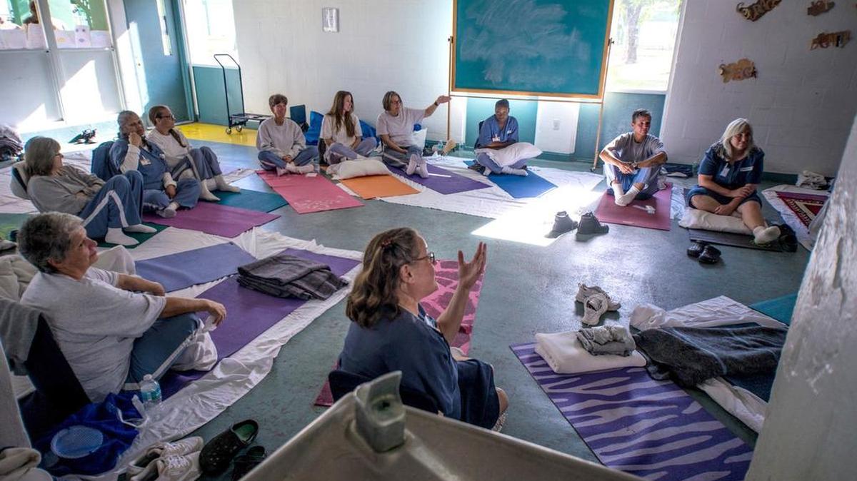 Catherine Laflour, center talks about the calmness and control she's learned during a Prison S.M.A.R.T silent three-day retreat at Homestead Correctional Institution for Women.