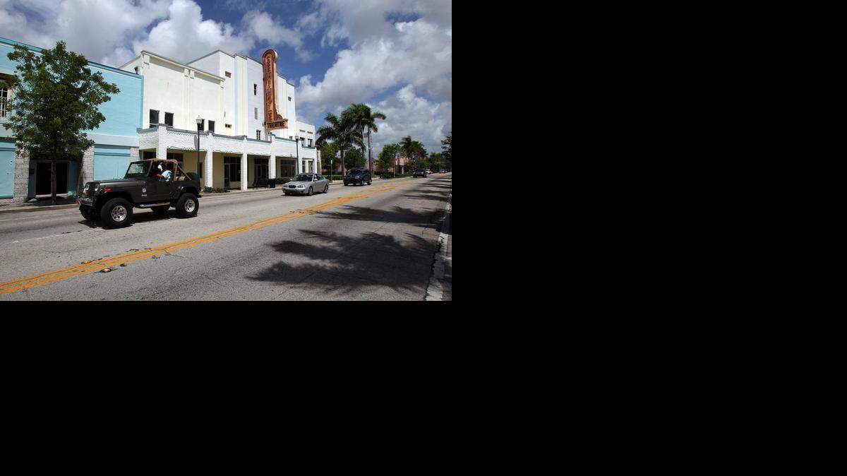 
Traffic on Krome Avenue passes the vacated Seminole Theater, which is a contributor to the general weathered look of Homestead’s downtown.

