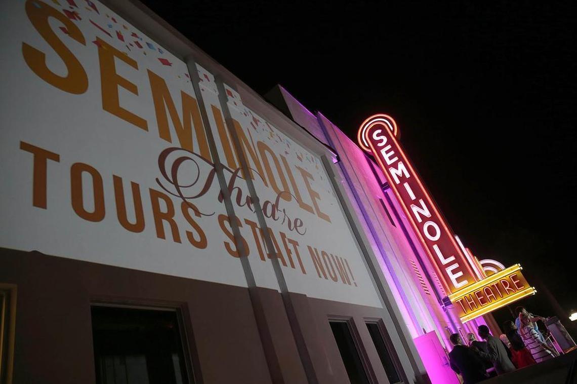 Homestead residents celebrate the reopening of the historic Seminole Theatre with a marquee lighting. The theater opened to the public for the first time in nearly 40 years on Wednesday, Oct. 28, 2015.