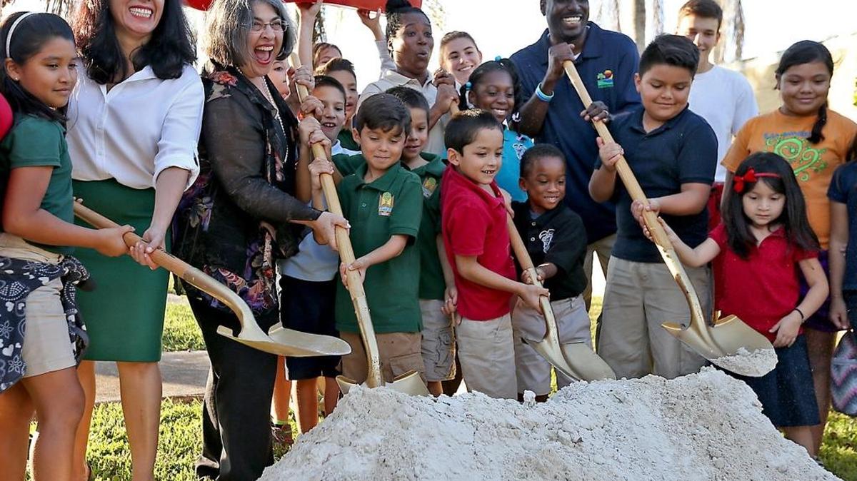 Miami-Dade County Parks deputy director Maria Nardi, Miami-Dade County District 8 Commissioner Daniella Levine Cava and South Miami-Dade Aquatics manager Dewayne Deal get a little help from some of the neighborhood kids as they break ground on a new aquatic complex at South Dade Park on Wednesday, Nov.16, 2016.