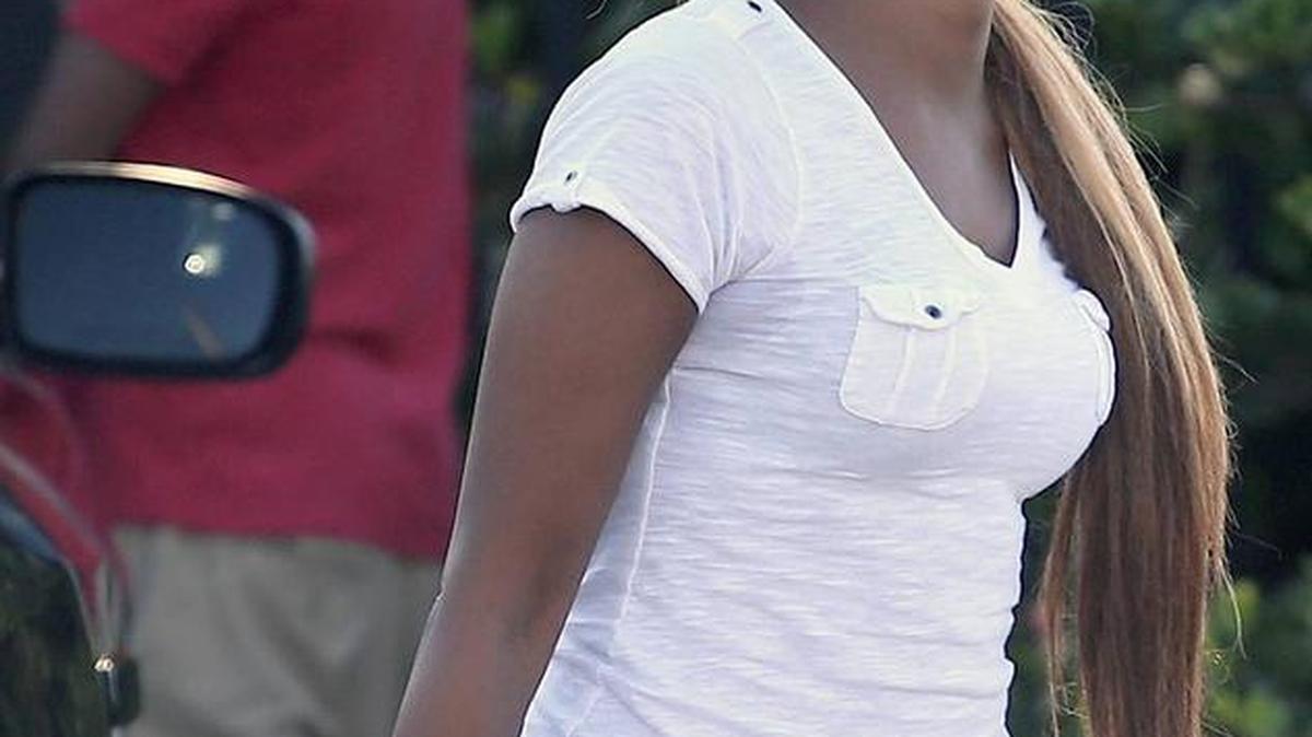 An unidentified woman mourns the death of Roderick Sweeting, 17, who was shot and killed April 5 as he walked home from Norland High School in Miami Gardens.